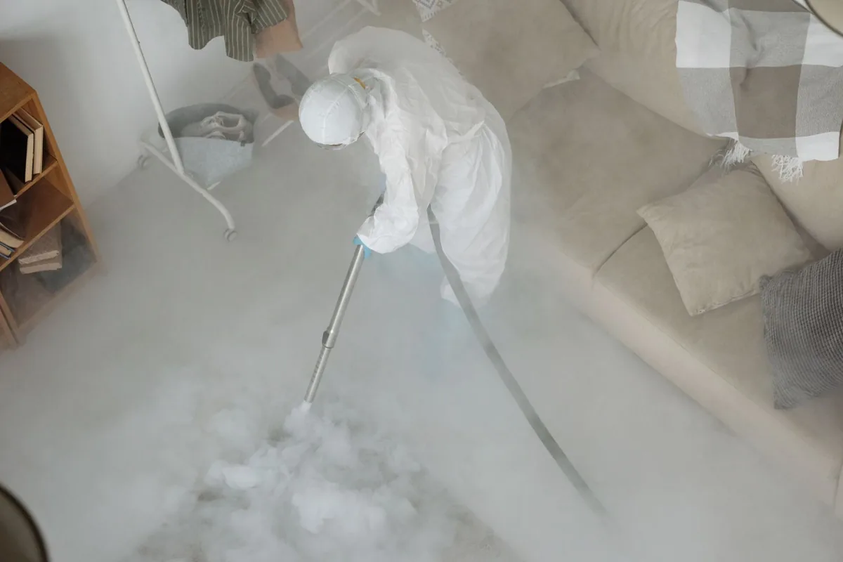 Biohazard cleanup technician in protective equipment, Cassopolis, MI